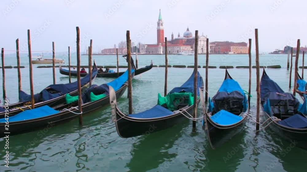 Gondolas moored in Piazza San Marco with San Giorgio Maggiore church in the background Gondolas moored in Piazza San Marco with San Giorgio Maggiore church in the background