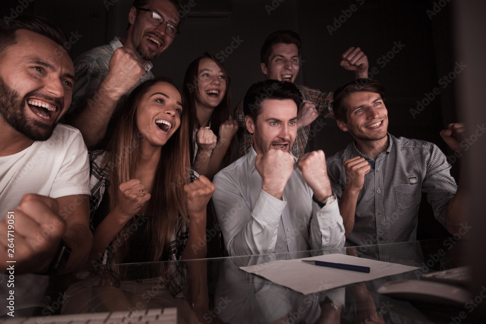 Fototapeta premium happy business team looking at computer monitor
