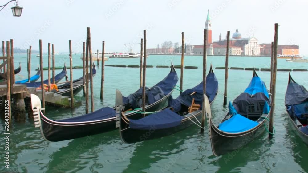 Gondolas moored in Piazza San Marco with San Giorgio Maggiore church in the background Gondolas moored in Piazza San Marco with San Giorgio Maggiore church in the background