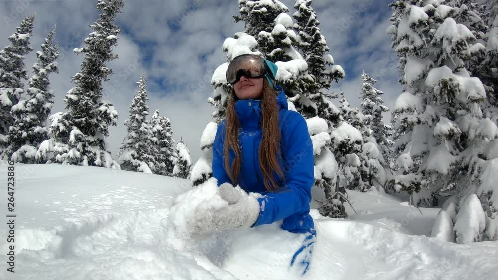 The girl throws snow in a snowy forest slow motion. Christmas tree. The girl throws snow in a snowy forest slow motion. Christmas tree.