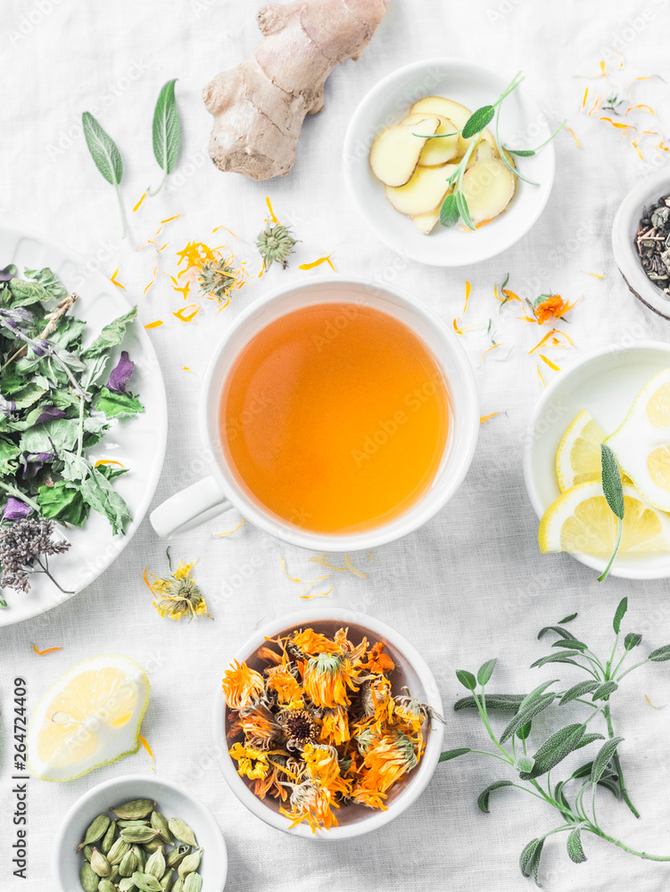 Herbal detox antioxidant tea and the ingredients for cooking on a light background, top view. Herbal homeopathic recipe Herbal detox antioxidant tea and the ingredients for cooking on a light background, top view. Herbal homeopathic recipe