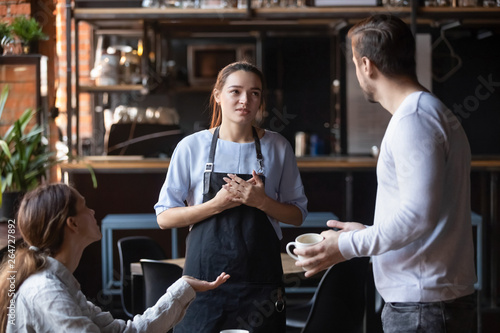 Obraz na plátne Dissatisfied restaurant clients complaining about bad service