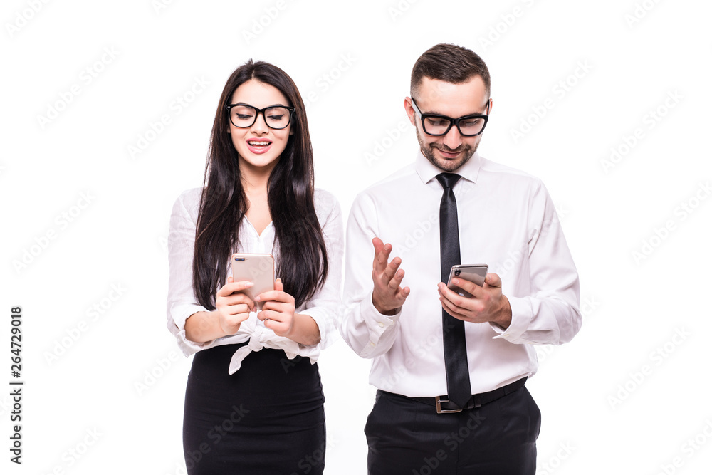 Portrait of a smiling business couple holding mobile phones and talking isolated over white background Portrait of a smiling business couple holding mobile phones and talking isolated over white background