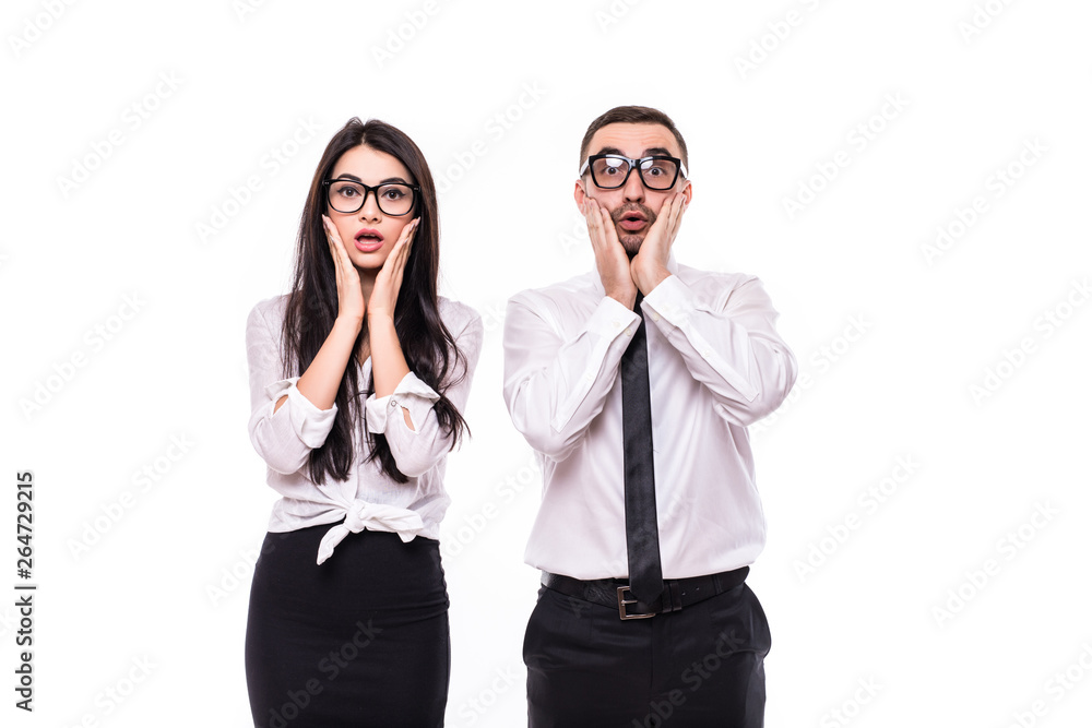 Portrait of young shocked business colleagues couple isolated over white wall background. Portrait of young shocked business colleagues couple isolated over white wall background.