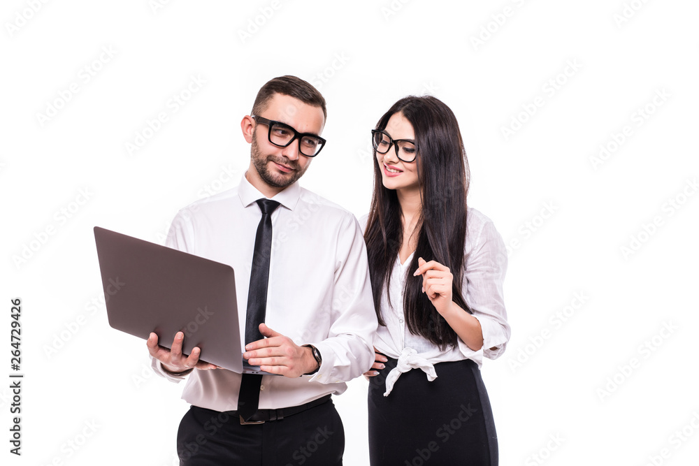Portrait of a happy business couple looking at laptop computer isolated over white background Portrait of a happy business couple looking at laptop computer isolated over white background