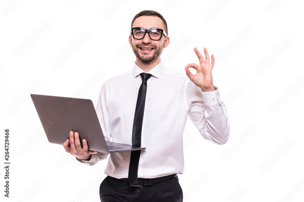 Image of a handsome business man using laptop computer showing okay gesture isolated over white background