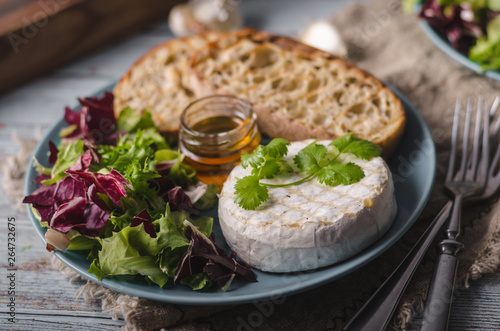 Grilled camembert cheese with honey