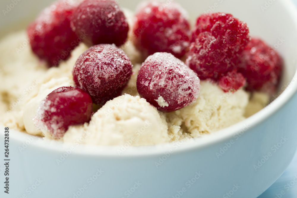 homemade ice cream with frozen cherry and raspberry . healthy sweets concept homemade ice cream with frozen cherry and raspberry . healthy sweets concept