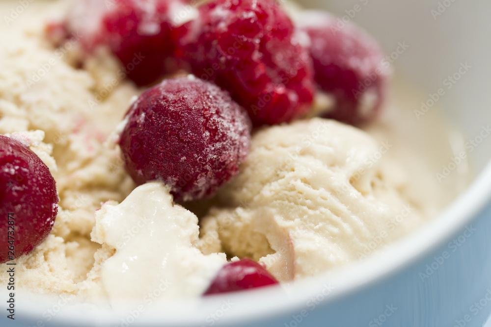 homemade ice cream with frozen cherry and raspberry . healthy sweets concept homemade ice cream with frozen cherry and raspberry . healthy sweets concept