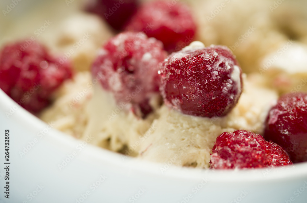 homemade ice cream with frozen cherry and raspberry . healthy sweets concept homemade ice cream with frozen cherry and raspberry . healthy sweets concept