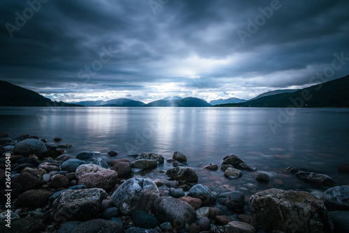 Mystic landscape lake scenery in Scotland: Cloudy sky, sunbeams and mountain range in loch Linnhe © Patrick Daxenbichler