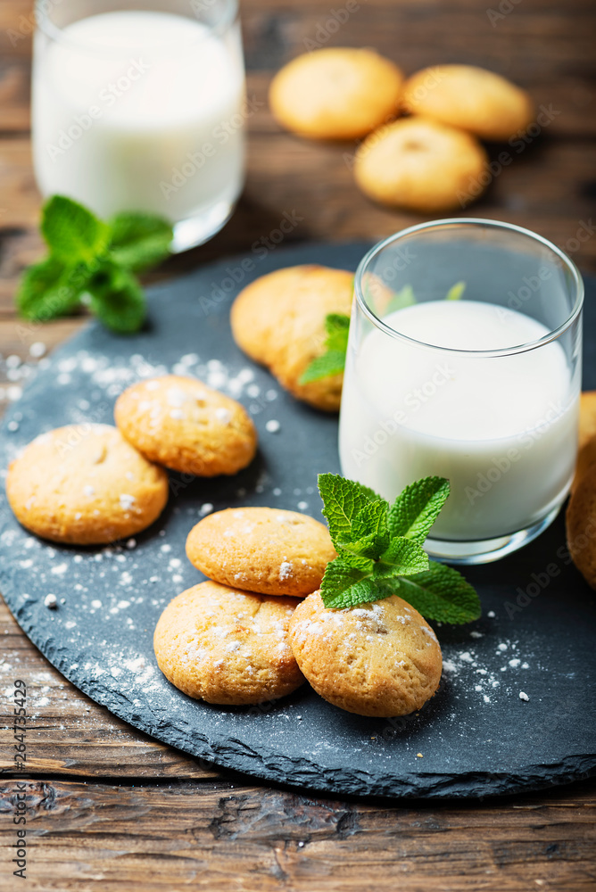 Homemeade cookies with milk on the wooden table Homemeade cookies with milk on the wooden table