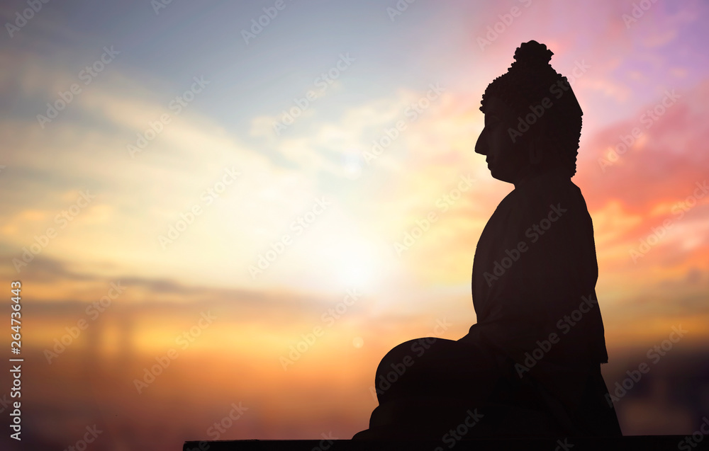 Buddhist concept: Vesak day Silhouette Buddha with blurred travel