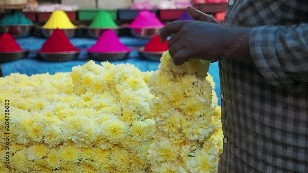 Flower vendor's hands at work in the market in Mysore, Karnatake, India