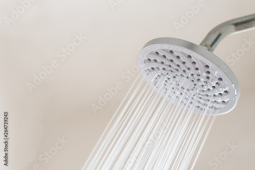 Close up of a Shower head with running water. concept of hygiene and healthcare