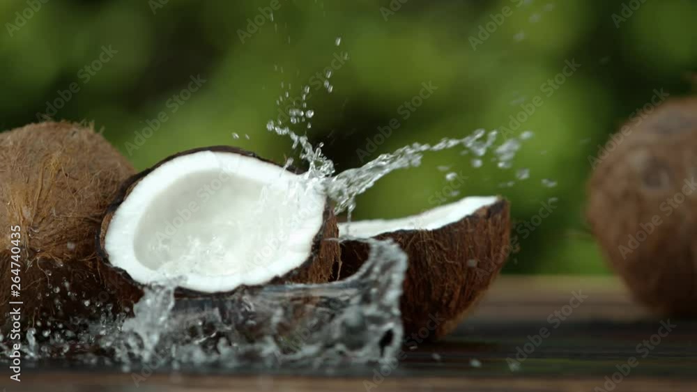 Super slow motion of coconut with splash. Filmed on high speed cinema camera, 1000 fps. Super slow motion of coconut with splash. Filmed on high speed cinema camera, 1000 fps.