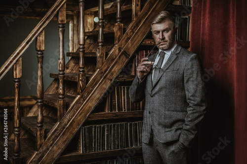 pensive man at home library