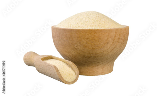 Obraz na plátně semolina in wooden bowl and scoop isolated on white background