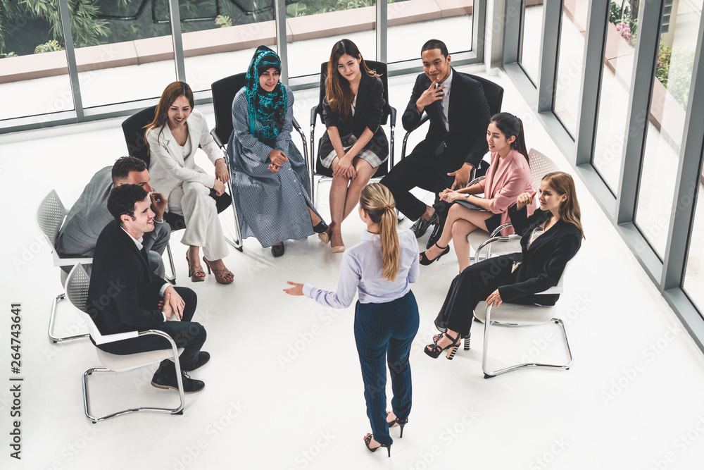© InfiniteFlow - Businesswomen and businessmen attending group meeting conference in office room. Corporate business team concept.
