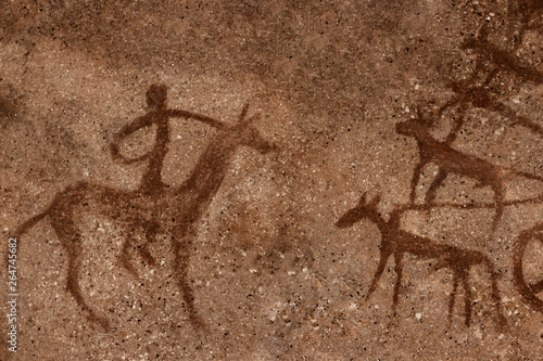 Ancient hunters on the cave wall. history of antiquities, archaeology.