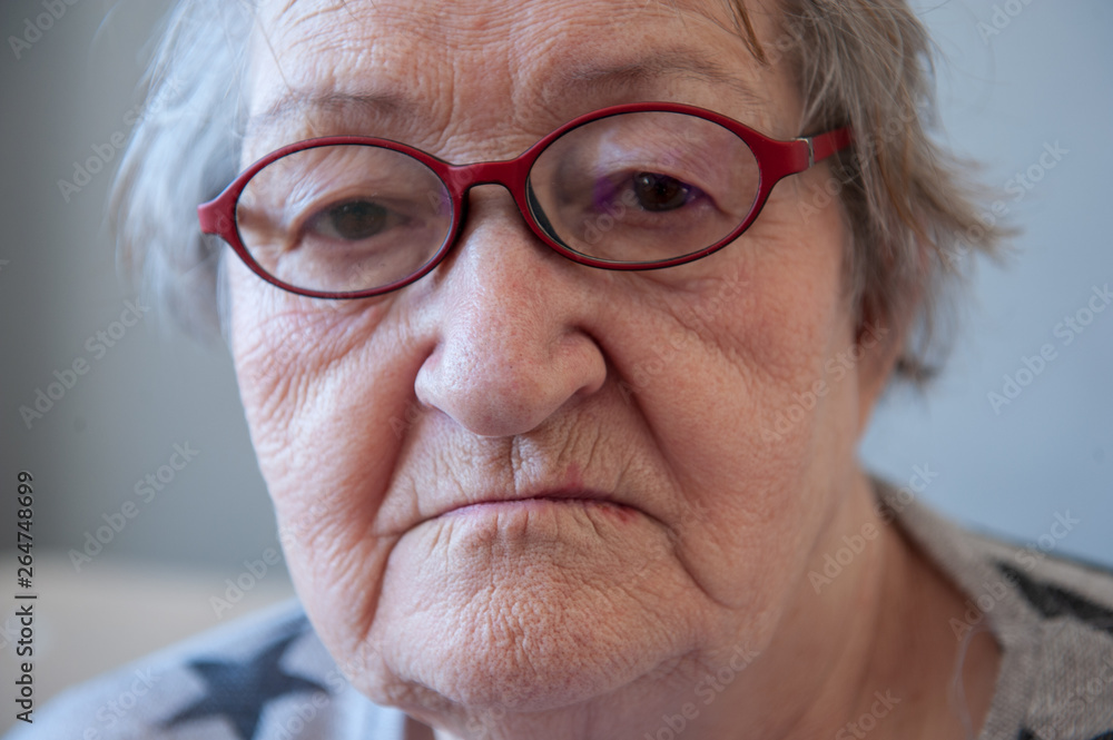 Elderly woman with beautiful face in wrinkles with gray hair with glasses. Closeup portrait. Grandmother Retired waiting for social assistance. Elderly woman with beautiful face in wrinkles with gray hair with glasses. Closeup portrait. Grandmother Retired waiting for social assistance.