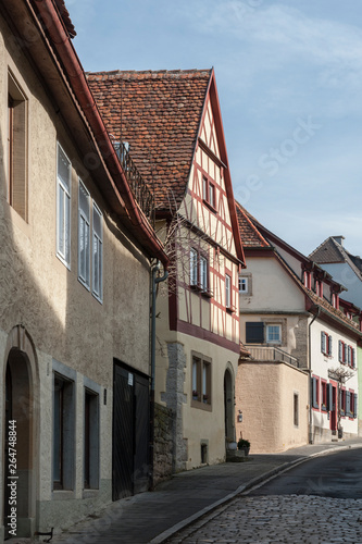 ROTHENBURG OB DER TAUBER, GERMANY -  MARCH 05, 2018: Historic colorful half-timbered houses in the medieval town Rothenburg ob der Tauber, one of the most beautiful villages in Europe, Germany © LAURA