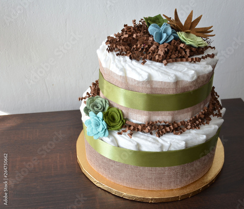 Nappy cake made from nappies, ribbons and flower seemed decorations
