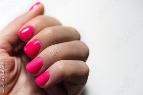 well-groomed, manicured fingers of the hand on white background