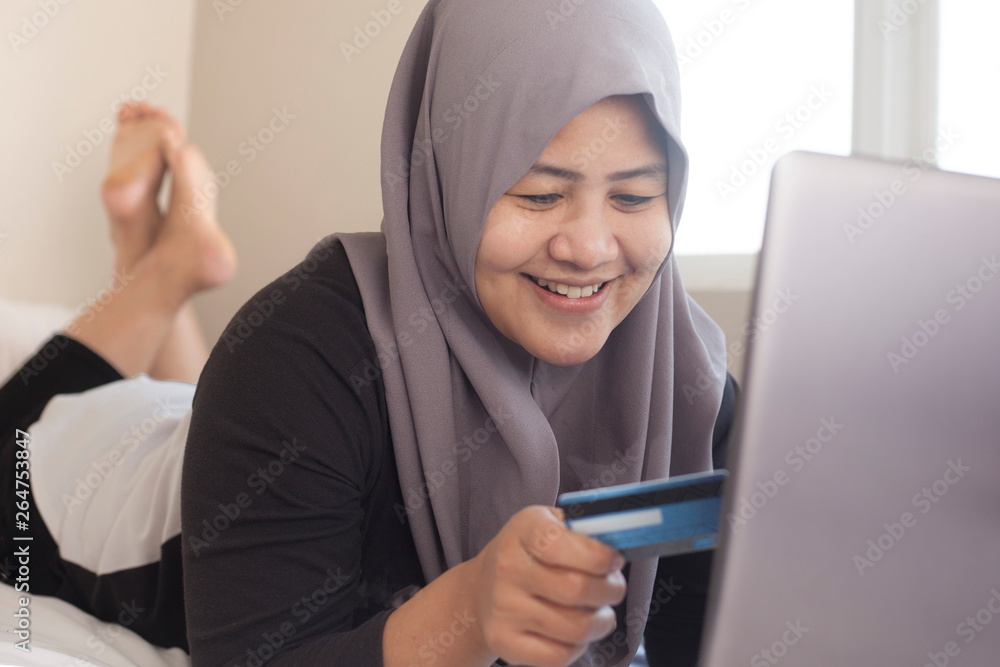 Muslim Woman Making Online Purchase Muslim Woman Making Online Purchase