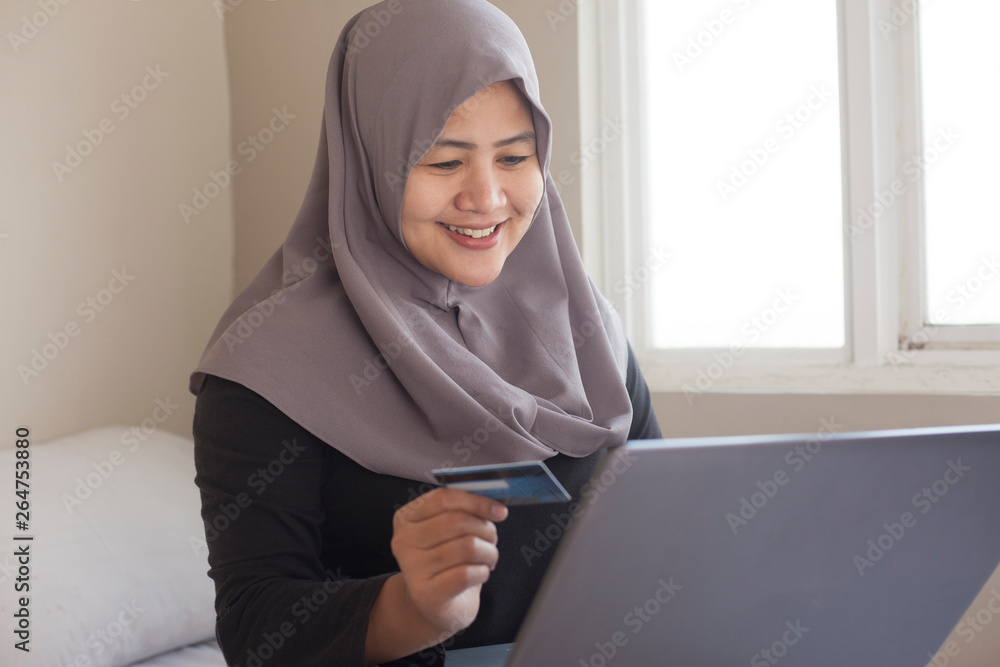 Muslim Woman Making Online Purchase Muslim Woman Making Online Purchase