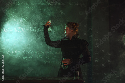 Valokuvatapetti Scientist researcher with a flask of radioactive material