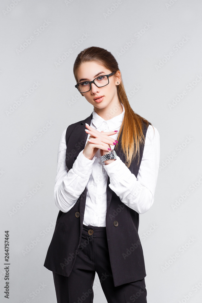 Portrait of blonde businesswoman dressed in black suit, studio isolated girl with crossed arms. Portrait of blonde businesswoman dressed in black suit, studio isolated girl with crossed arms.