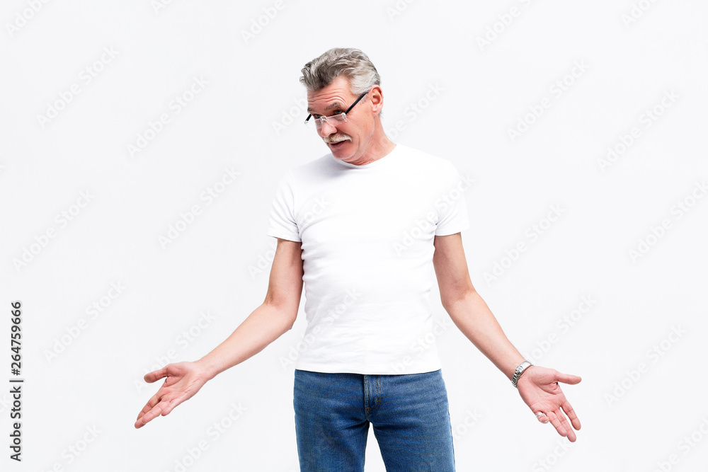 Handsome senior man posing to the camera, wearing at casual clothes. Lifestyle. Handsome senior man posing to the camera, wearing at casual clothes. Lifestyle.