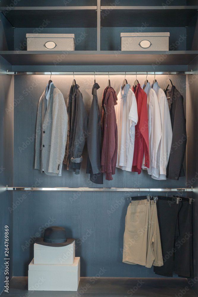 modern closet with clothes hanging modern closet with clothes hanging