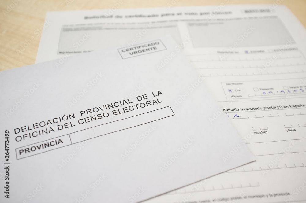 Mature man filling .request form for absentee vote or postal vote Mature man filling .request form for absentee vote or postal vote