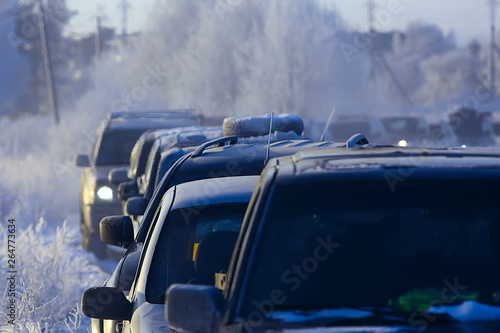 cars on winter road traffic jam city / winter weather on the city highway, the view from car in the fog and snow road