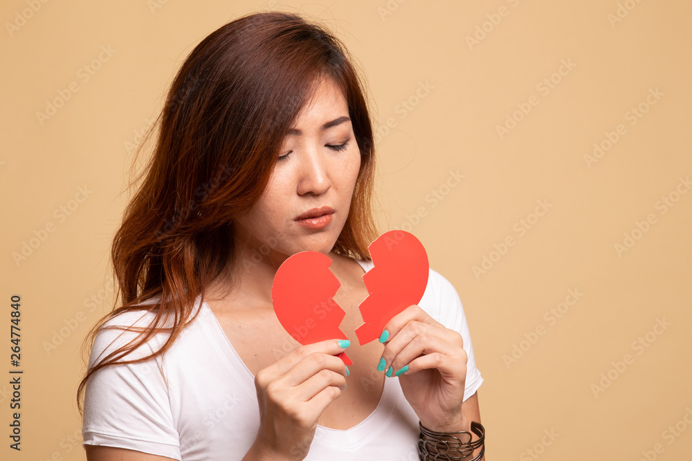 Beautiful young Asian woman with broken heart. Beautiful young Asian woman with broken heart.