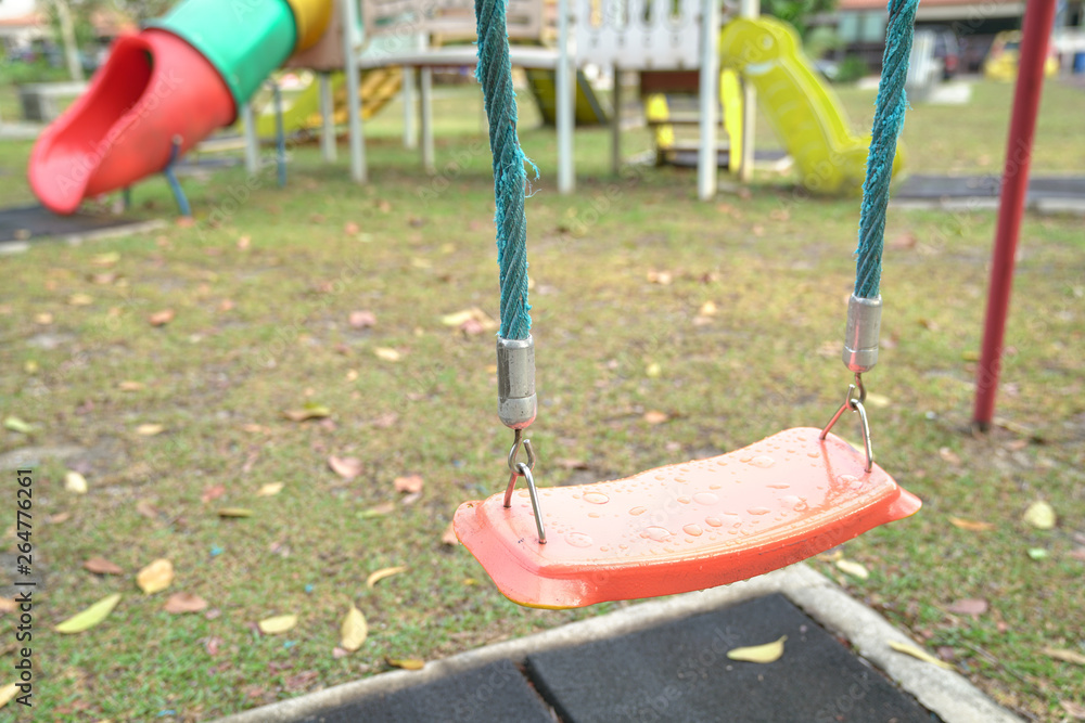 Empty playground swing