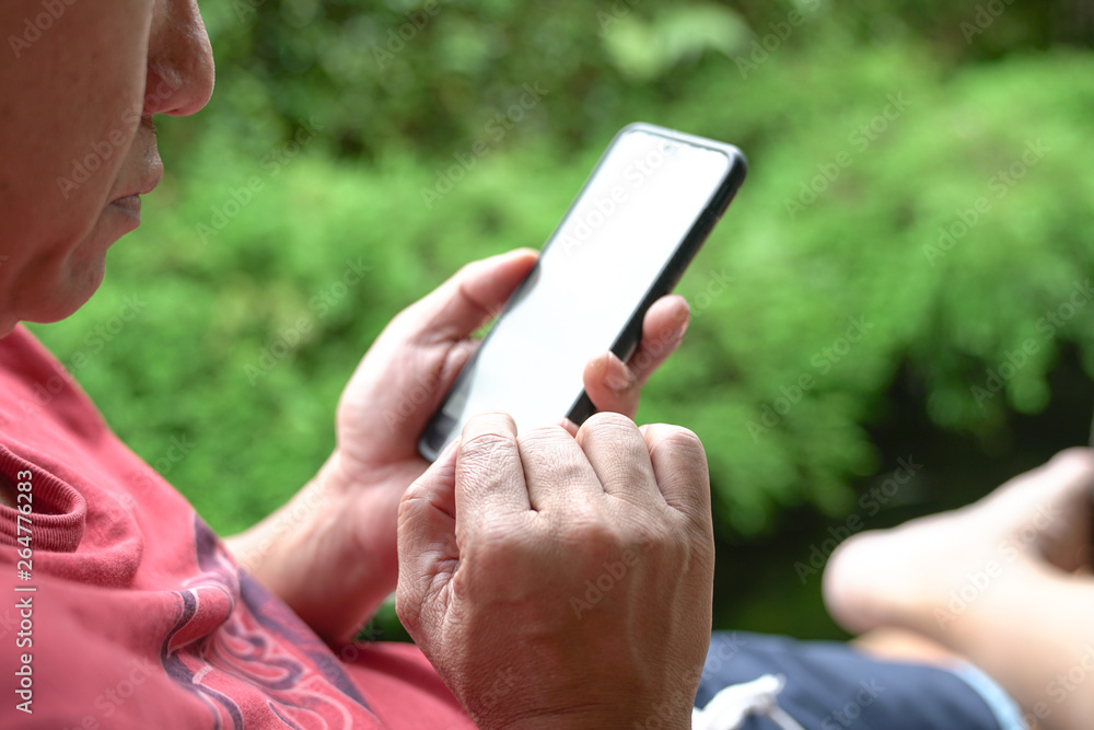 Closeup view of man's hands on mobile phone Closeup view of man's hands on mobile phone