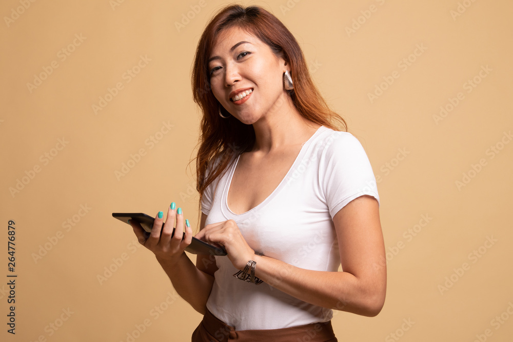 Young Asian woman with a computer tablet. Young Asian woman with a computer tablet.