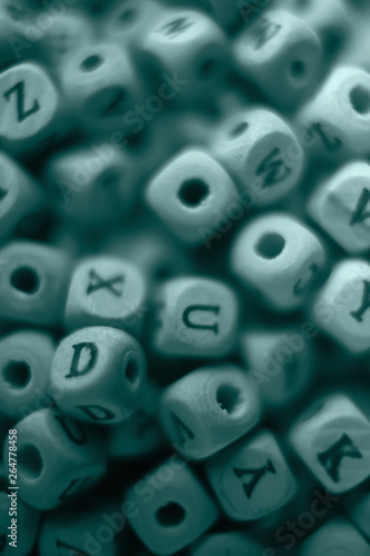 cubes beads letters alphabet   background of wooden cubes with alphabet letters  concept education reading  learning letters