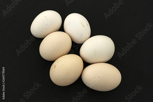 Eat real organic chicken eggs for your health, organic chicken eggs on a black background,