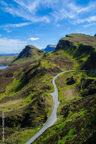 Scenic view of the Quiraing pass, Isle Of Skye, Scottish highlands, Europe. Tourist popular hiking spot, or attraction/destination in Scotland. Beautiful green natural landscape in summer holiday.