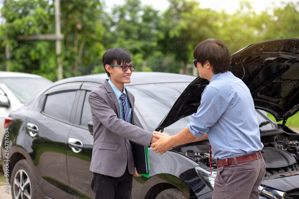 Insurance agent handshake with customer. Car insurance.
