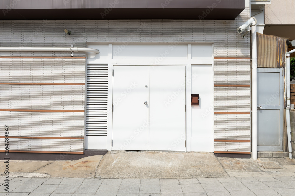 sidewalk by street wall & door sidewalk by street wall & door