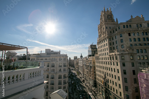 Panorama top view of Gran Via, main shopping street in Madrid from roof top bar, capital of Spain, Europe. 