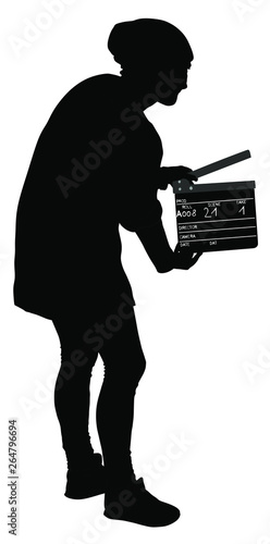 Operator holding clapperboard during the production of film vector silhouette illustration. Film-making or film production concept. Film worker on set. Movie scene start. Behind the scene. Clapper.