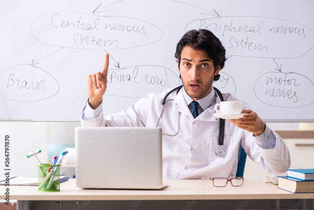 Young male doctor neurologist in front of whiteboard Young male doctor neurologist in front of whiteboard