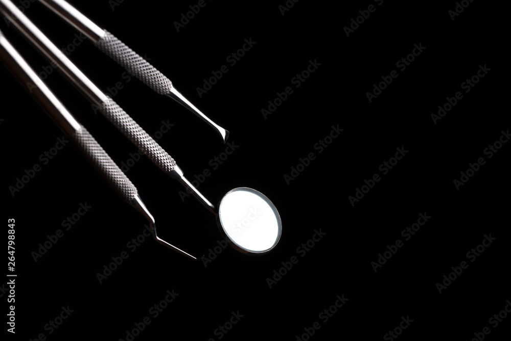 Endodontic instruments. Dental mirror. Dental instruments in the dark. Endodontic instruments. Dental mirror. Dental instruments in the dark.