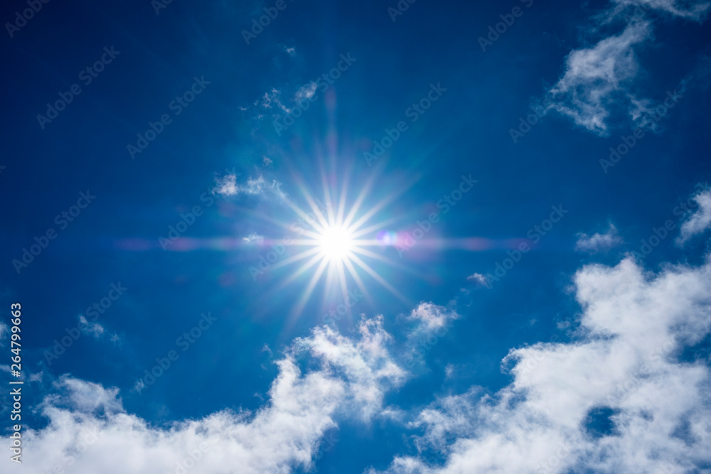 Summer background, sunlight and clouds on blue sky, Serra da Estrela, Portugal. Sky sun rays and clouds. Summer background, sunlight and clouds on blue sky, Serra da Estrela, Portugal. Sky sun rays and clouds.